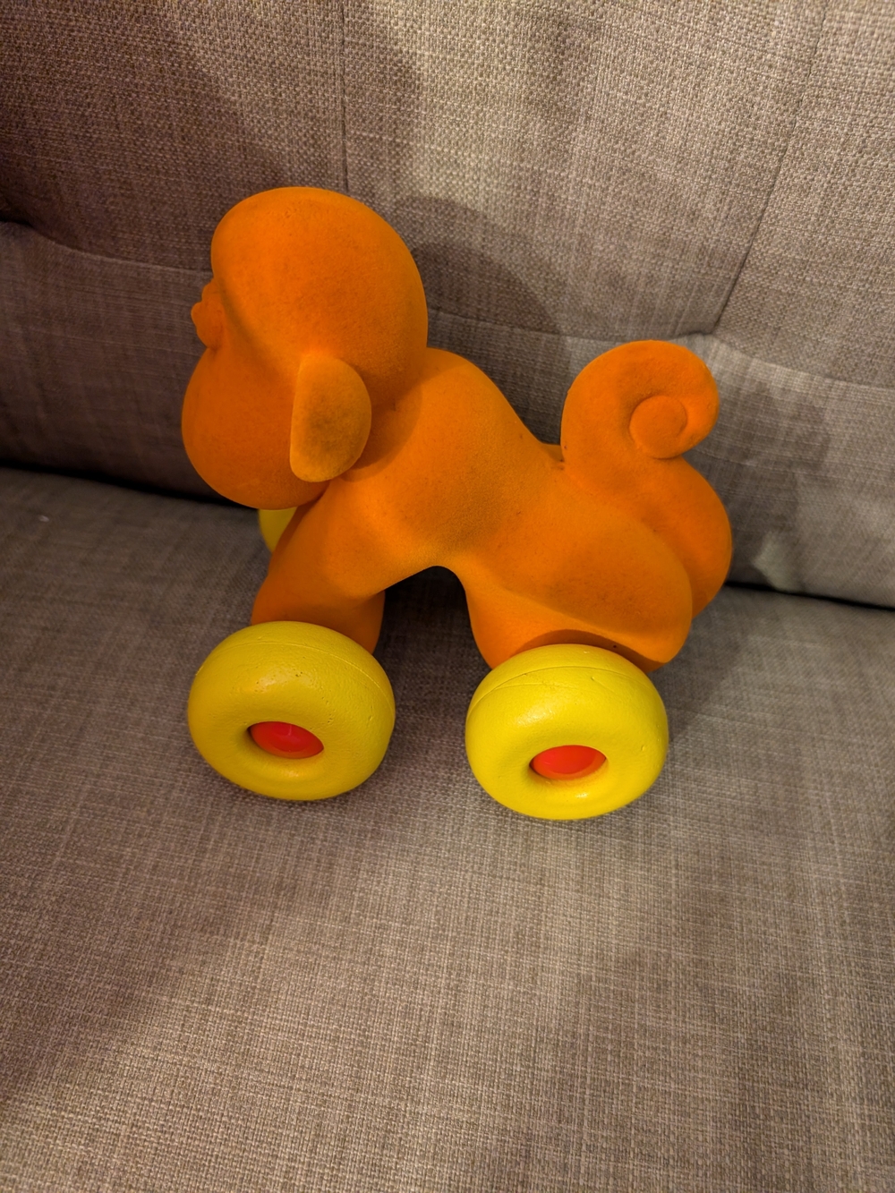 Orange Pull-Along Puppy Toy with Yellow Wheels